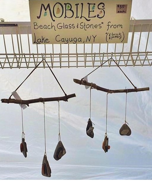 I have several of these Beach Glass and Stone Mobiles! These are made from beach glass, stone, brick, and pottery collected at Lake Cayuga, New York, this past summer. They are hung with hemp cord from Sycamore twigs. 
Art Rains